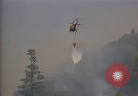 Image of aircraft fighting fires California United States USA, 1987, second 10 stock footage video 65675075623