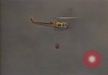 Image of aircraft fighting fires California United States USA, 1987, second 15 stock footage video 65675075623