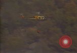 Image of aircraft fighting fires California United States USA, 1987, second 18 stock footage video 65675075623