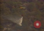 Image of aircraft fighting fires California United States USA, 1987, second 19 stock footage video 65675075623