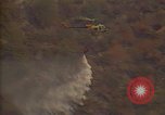 Image of aircraft fighting fires California United States USA, 1987, second 20 stock footage video 65675075623