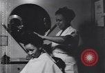 Image of African American beautician Atlanta Georgia USA, 1939, second 5 stock footage video 65675075666