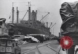 Image of Transport ships being loaded with troops and supplies for invasion task force United States USA, 1944, second 4 stock footage video 65675075793