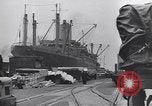 Image of Transport ships being loaded with troops and supplies for invasion task force United States USA, 1944, second 5 stock footage video 65675075793
