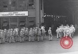 Image of Transport ships being loaded with troops and supplies for invasion task force United States USA, 1944, second 10 stock footage video 65675075793