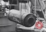 Image of Transport ships being loaded with troops and supplies for invasion task force United States USA, 1944, second 15 stock footage video 65675075793
