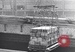 Image of Transport ships being loaded with troops and supplies for invasion task force United States USA, 1944, second 18 stock footage video 65675075793
