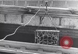 Image of Transport ships being loaded with troops and supplies for invasion task force United States USA, 1944, second 20 stock footage video 65675075793