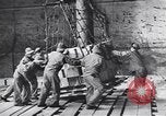 Image of Transport ships being loaded with troops and supplies for invasion task force United States USA, 1944, second 21 stock footage video 65675075793