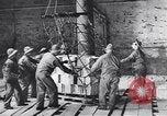 Image of Transport ships being loaded with troops and supplies for invasion task force United States USA, 1944, second 22 stock footage video 65675075793