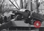 Image of Transport ships being loaded with troops and supplies for invasion task force United States USA, 1944, second 34 stock footage video 65675075793