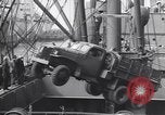 Image of Transport ships being loaded with troops and supplies for invasion task force United States USA, 1944, second 35 stock footage video 65675075793