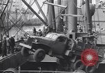 Image of Transport ships being loaded with troops and supplies for invasion task force United States USA, 1944, second 36 stock footage video 65675075793