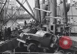 Image of Transport ships being loaded with troops and supplies for invasion task force United States USA, 1944, second 37 stock footage video 65675075793