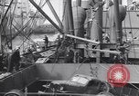 Image of Transport ships being loaded with troops and supplies for invasion task force United States USA, 1944, second 39 stock footage video 65675075793