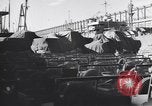 Image of Transport ships being loaded with troops and supplies for invasion task force United States USA, 1944, second 40 stock footage video 65675075793