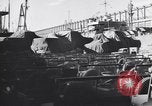 Image of Transport ships being loaded with troops and supplies for invasion task force United States USA, 1944, second 43 stock footage video 65675075793