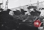Image of Transport ships being loaded with troops and supplies for invasion task force United States USA, 1944, second 44 stock footage video 65675075793