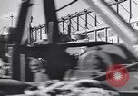 Image of Transport ships being loaded with troops and supplies for invasion task force United States USA, 1944, second 46 stock footage video 65675075793