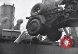 Image of Transport ships being loaded with troops and supplies for invasion task force United States USA, 1944, second 49 stock footage video 65675075793