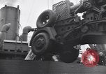 Image of Transport ships being loaded with troops and supplies for invasion task force United States USA, 1944, second 50 stock footage video 65675075793