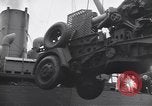 Image of Transport ships being loaded with troops and supplies for invasion task force United States USA, 1944, second 51 stock footage video 65675075793