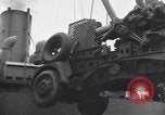 Image of Transport ships being loaded with troops and supplies for invasion task force United States USA, 1944, second 52 stock footage video 65675075793