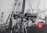 Image of Transport ships being loaded with troops and supplies for invasion task force United States USA, 1944, second 54 stock footage video 65675075793