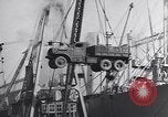 Image of Transport ships being loaded with troops and supplies for invasion task force United States USA, 1944, second 55 stock footage video 65675075793