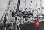 Image of Transport ships being loaded with troops and supplies for invasion task force United States USA, 1944, second 56 stock footage video 65675075793