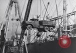 Image of Transport ships being loaded with troops and supplies for invasion task force United States USA, 1944, second 58 stock footage video 65675075793