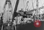 Image of Transport ships being loaded with troops and supplies for invasion task force United States USA, 1944, second 59 stock footage video 65675075793