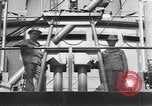 Image of Transport ships being loaded with troops and supplies for invasion task force United States USA, 1944, second 60 stock footage video 65675075793