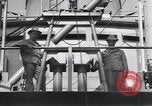 Image of Transport ships being loaded with troops and supplies for invasion task force United States USA, 1944, second 61 stock footage video 65675075793
