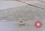 Image of outrigger canoe Pacific Ocean, 1945, second 1 stock footage video 65675075919