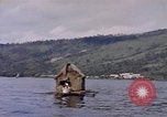 Image of outrigger canoe Pacific Ocean, 1945, second 20 stock footage video 65675075919