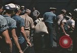 Image of Japanese prisoners leave captured submarines Pacific Theater, 1945, second 38 stock footage video 65675075961