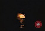 Image of A ship in flames at night Pacific Ocean, 1945, second 9 stock footage video 65675075997
