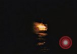 Image of A ship in flames at night Pacific Ocean, 1945, second 10 stock footage video 65675075997