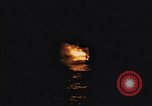 Image of A ship in flames at night Pacific Ocean, 1945, second 11 stock footage video 65675075997