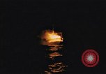 Image of A ship in flames at night Pacific Ocean, 1945, second 13 stock footage video 65675075997