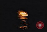 Image of A ship in flames at night Pacific Ocean, 1945, second 15 stock footage video 65675075997