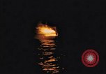 Image of A ship in flames at night Pacific Ocean, 1945, second 16 stock footage video 65675075997