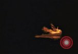 Image of A ship in flames at night Pacific Ocean, 1945, second 18 stock footage video 65675075997