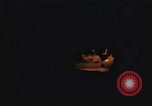 Image of A ship in flames at night Pacific Ocean, 1945, second 25 stock footage video 65675075997