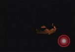 Image of A ship in flames at night Pacific Ocean, 1945, second 26 stock footage video 65675075997