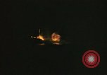 Image of A ship in flames at night Pacific Ocean, 1945, second 33 stock footage video 65675075997