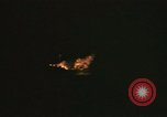 Image of A ship in flames at night Pacific Ocean, 1945, second 37 stock footage video 65675075997