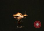 Image of A ship in flames at night Pacific Ocean, 1945, second 54 stock footage video 65675075997
