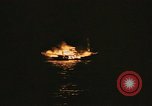 Image of A ship in flames at night Pacific Ocean, 1945, second 55 stock footage video 65675075997